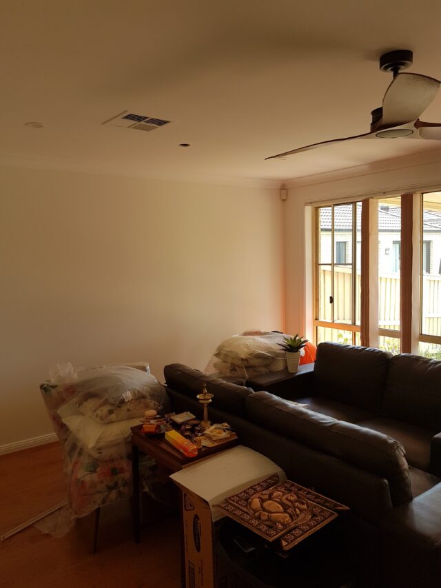 Neutral living room with warm white painted walls