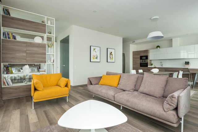 A cozy but beautifully designed living room with yellow accent sofa.