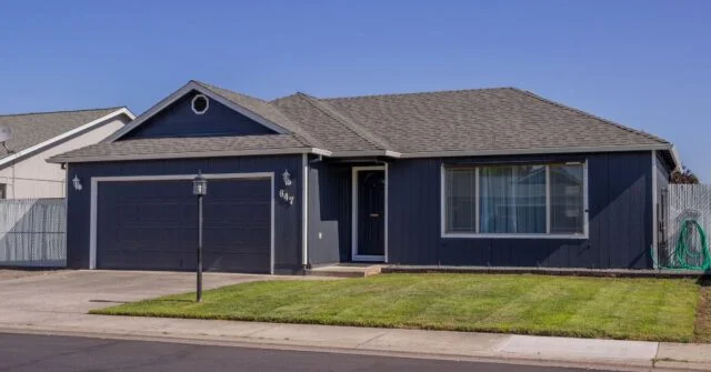 A dark colored house under extreme sun heat.