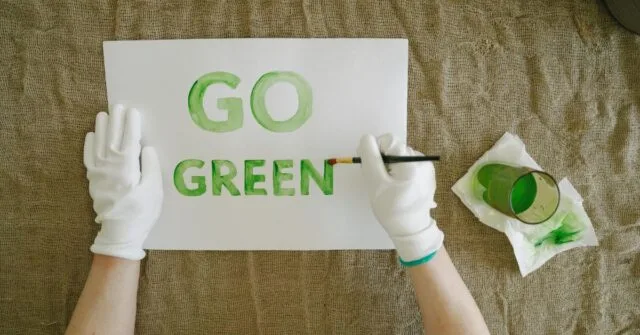 "Go Green" painted in a paper using eco friendly paint.