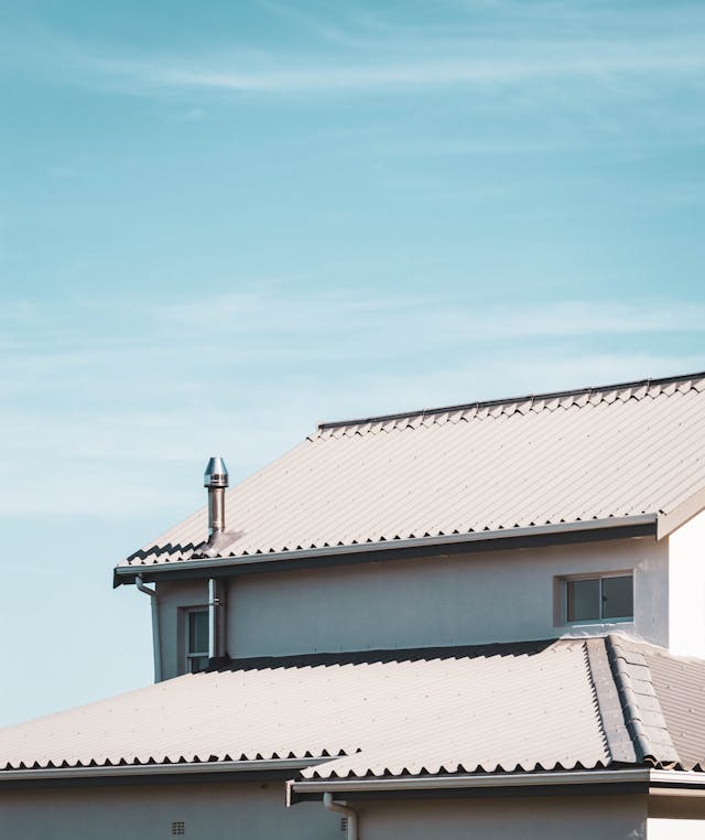 White Roof Of House Under Blue Sky.