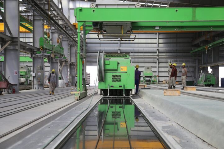 People Stands Near Green Metal Industrial Machine.