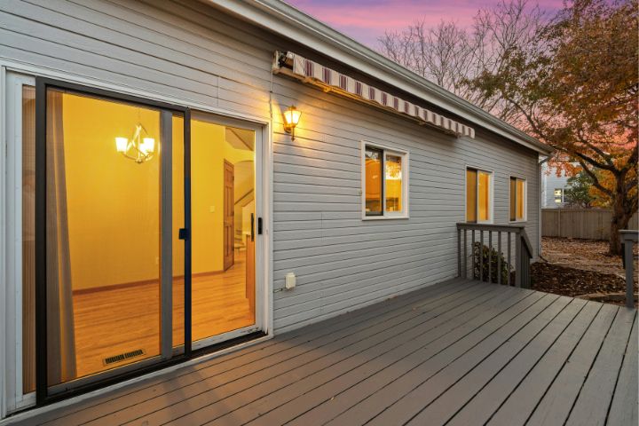 Cozy Backyard Deck at Sunset with Warm Lighting.