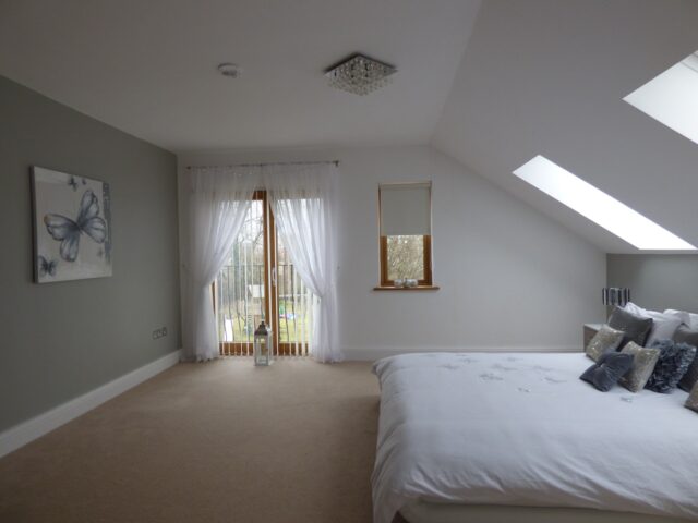 A clean and newly painted bedroom.