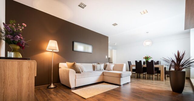 Brown feature wall in a modern ome with white ceilings and walls.