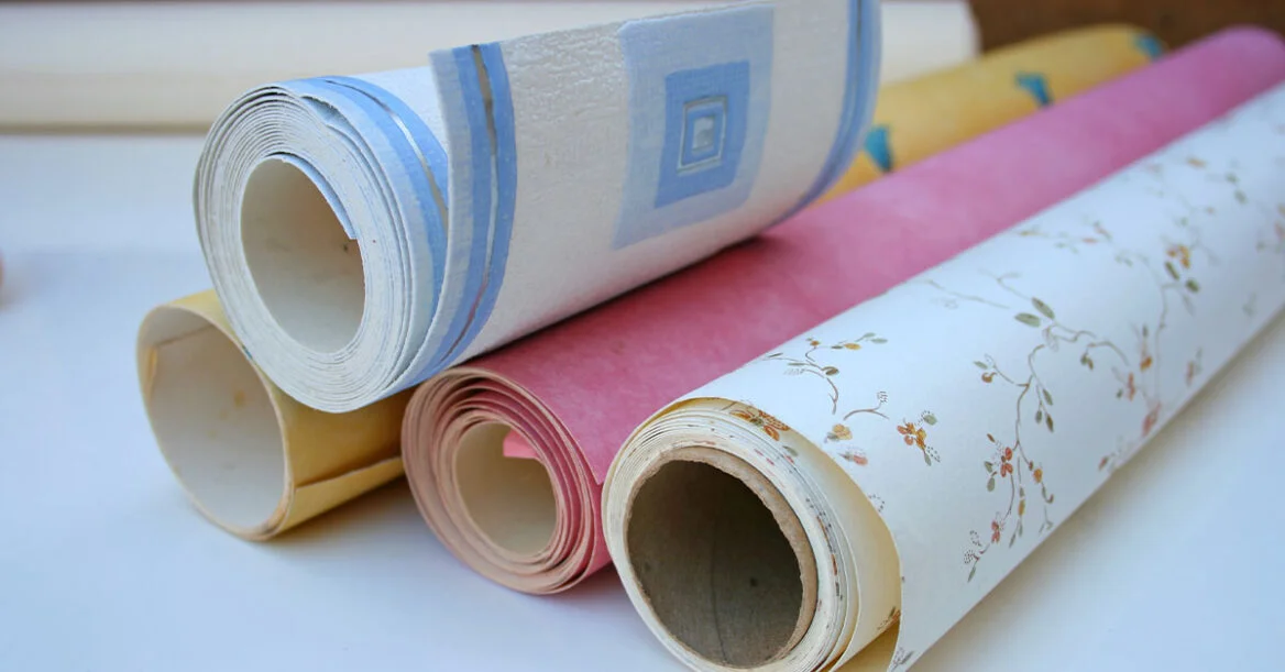 Rolls of wallpaper on a table