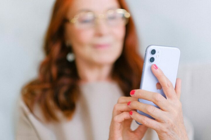 A woman trying to contact someone from her phone.